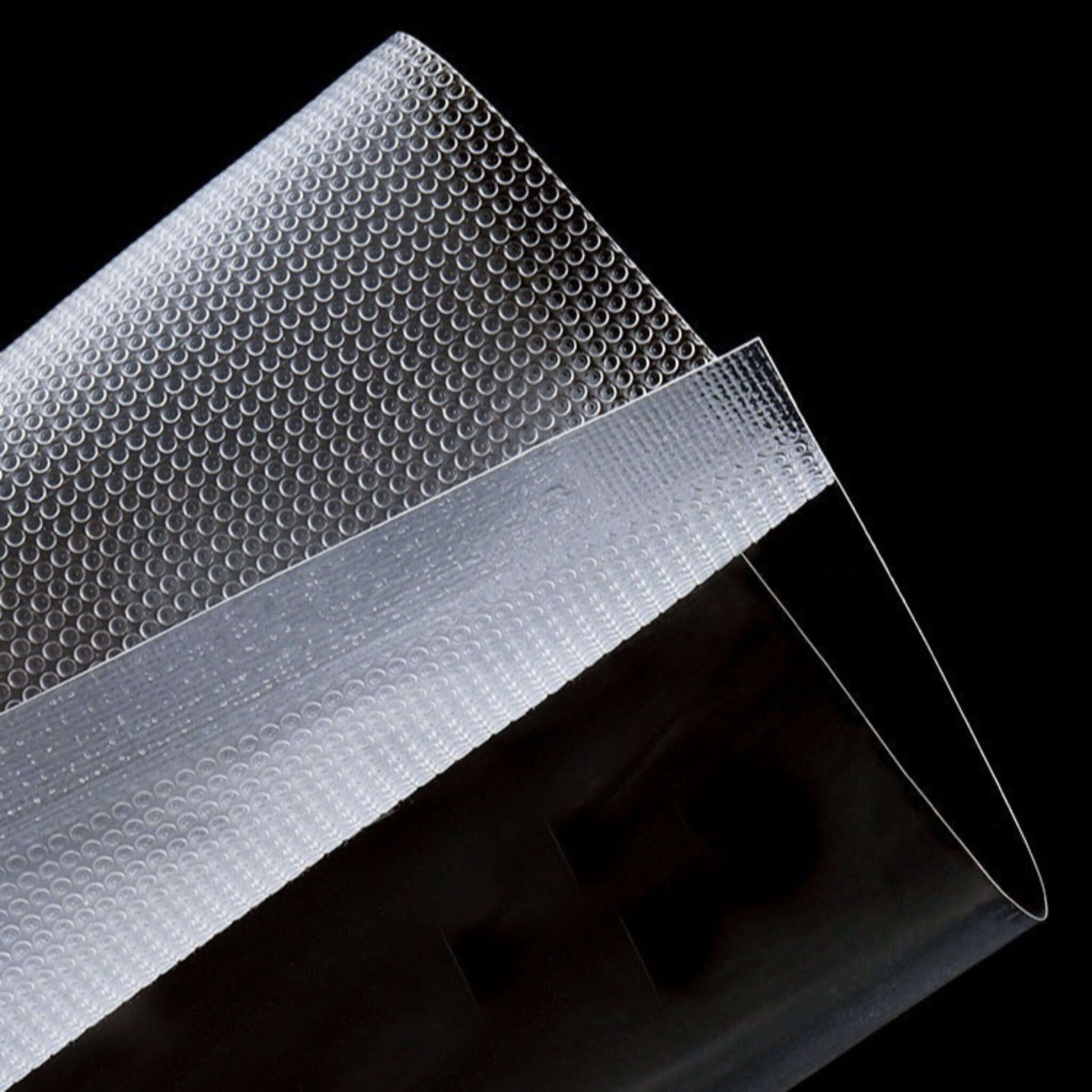 Clear vacuum sealer bags made of durable PA+PE material for food storage and preservation.
