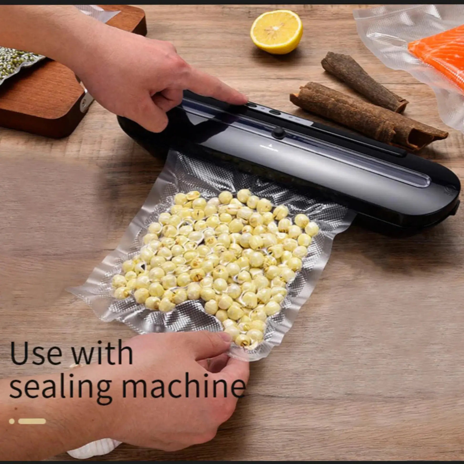 Person using a vacuum sealer machine to seal food in a vacuum bag.