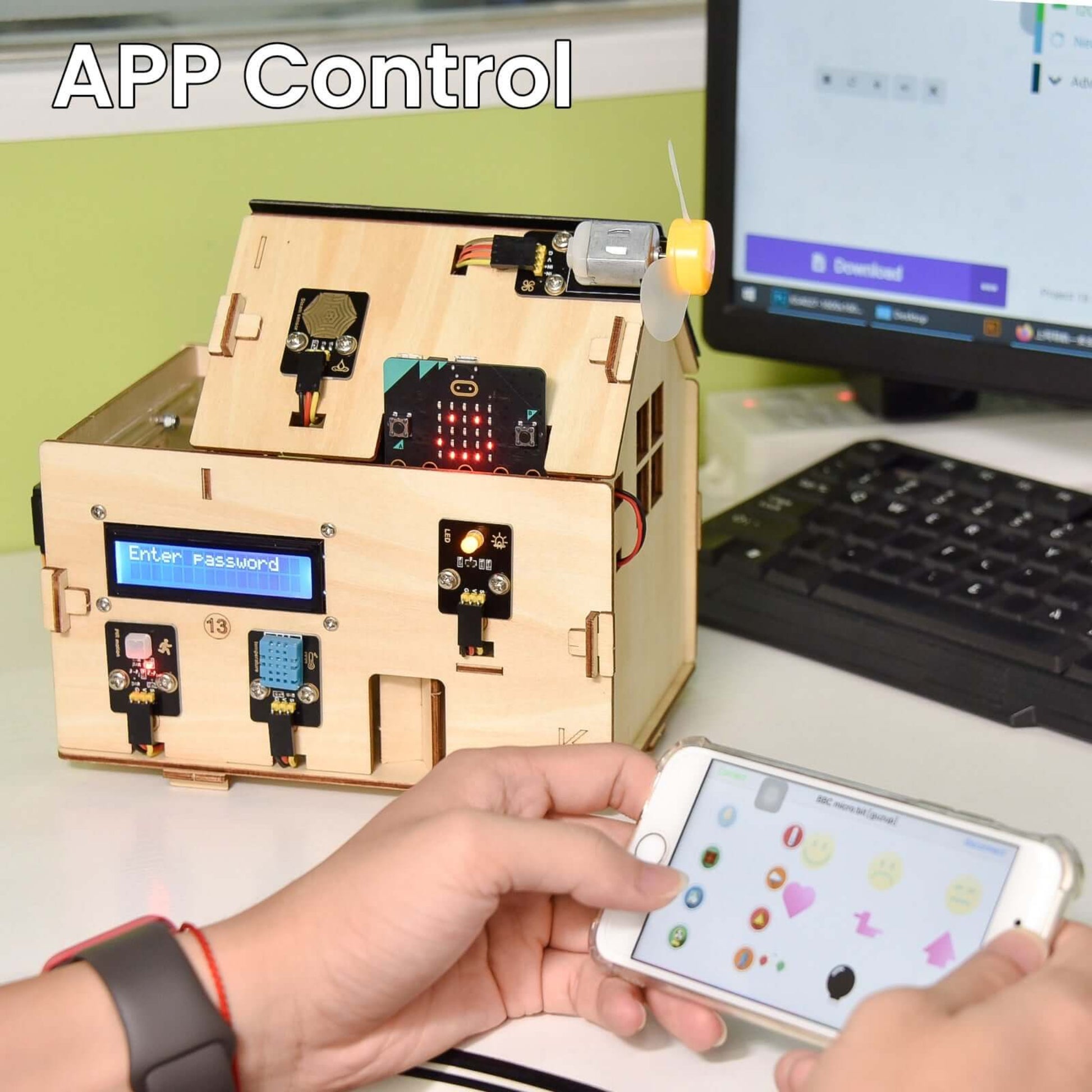 Hand operating a smartphone while controlling a wooden smart home model via app, showcasing Keyestudio IoT technology.