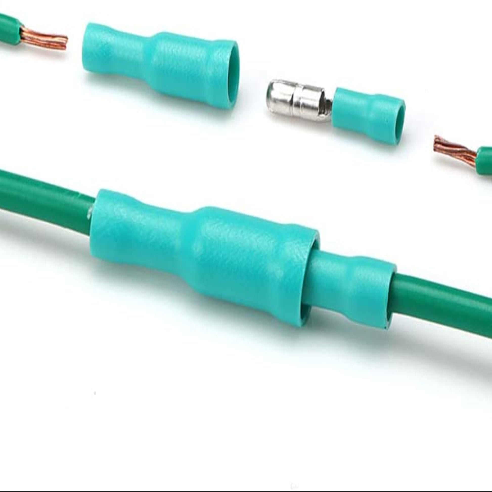 Close-up of insulated male/female bullet connectors for electrical wiring with green wires and crimp terminals.