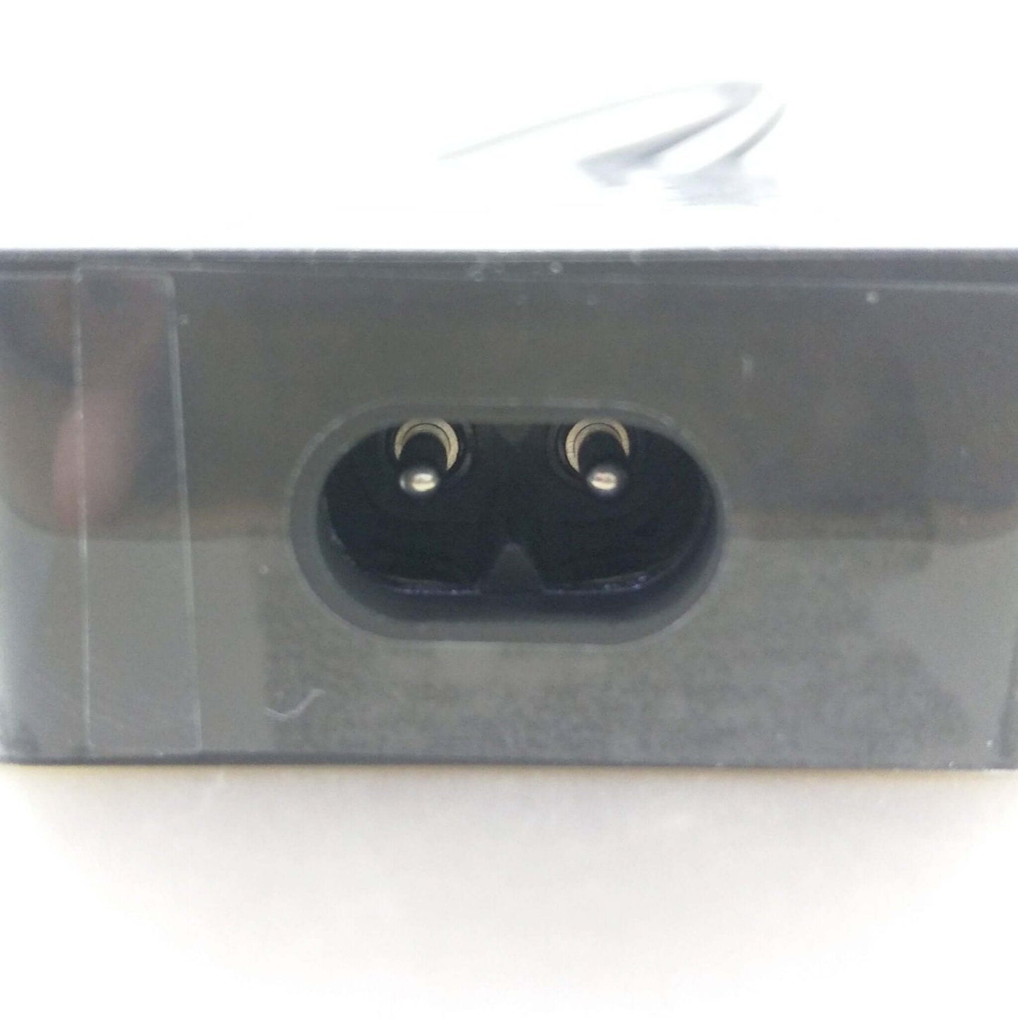 Close-up of the power connector port of a Microsoft Surface charger for reliable device charging.