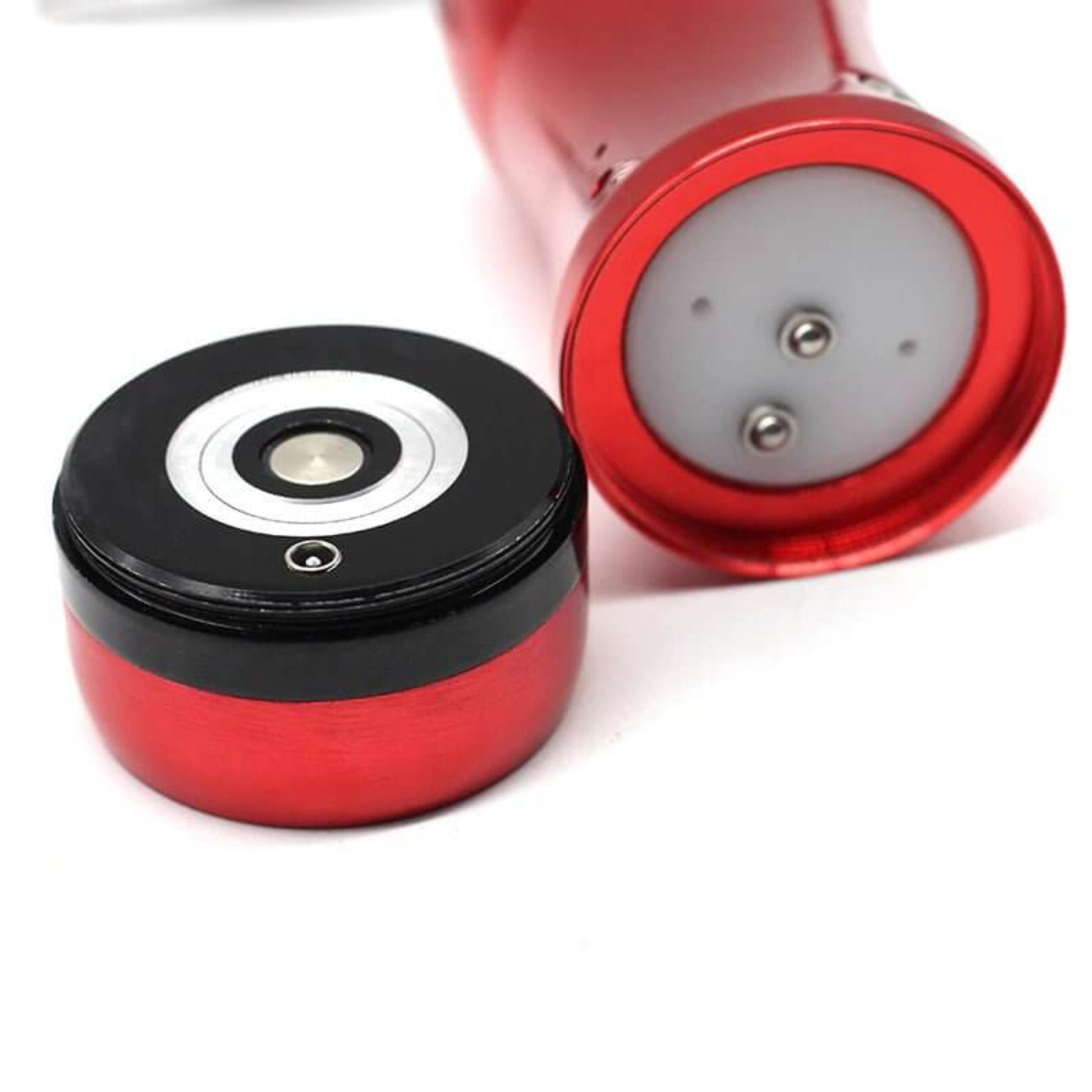 Close-up of the portable mini air compressor base and magnetic connection for the rechargeable airbrush kit.