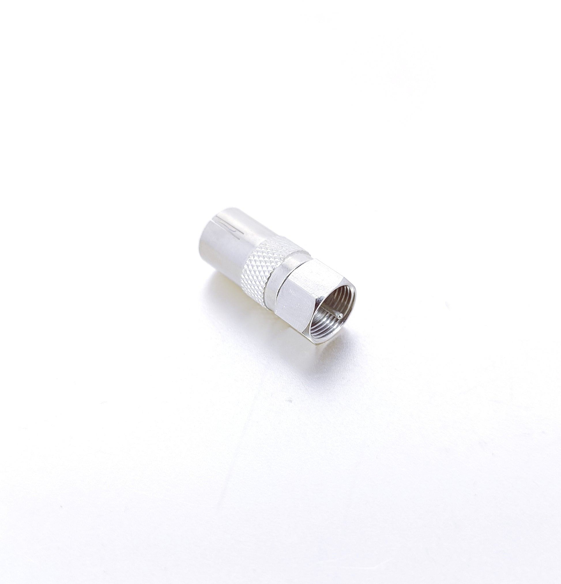 Close-up of a silver RF female socket to F-Type screw male plug adapter converter, showing the threaded F-Type male end.
