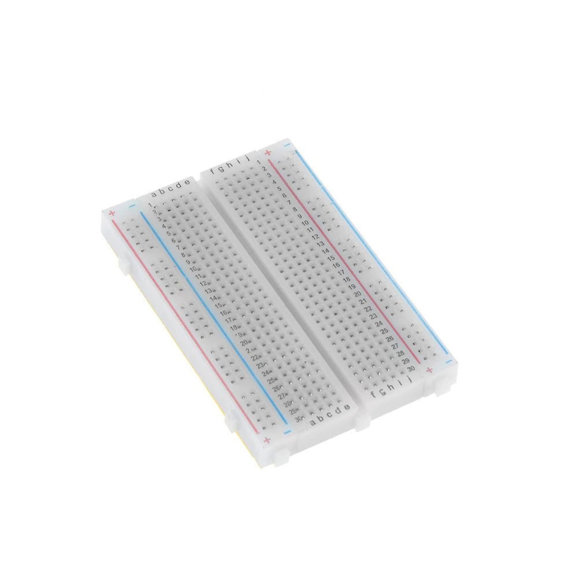 Close-up, angled view of two connected 400 tie-point solderless breadboards for electronic prototyping.