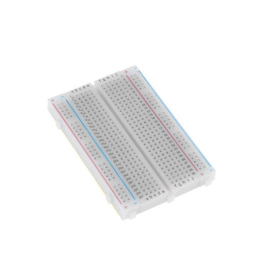 Close-up, angled view of two connected 400 tie-point solderless breadboards for electronic prototyping.