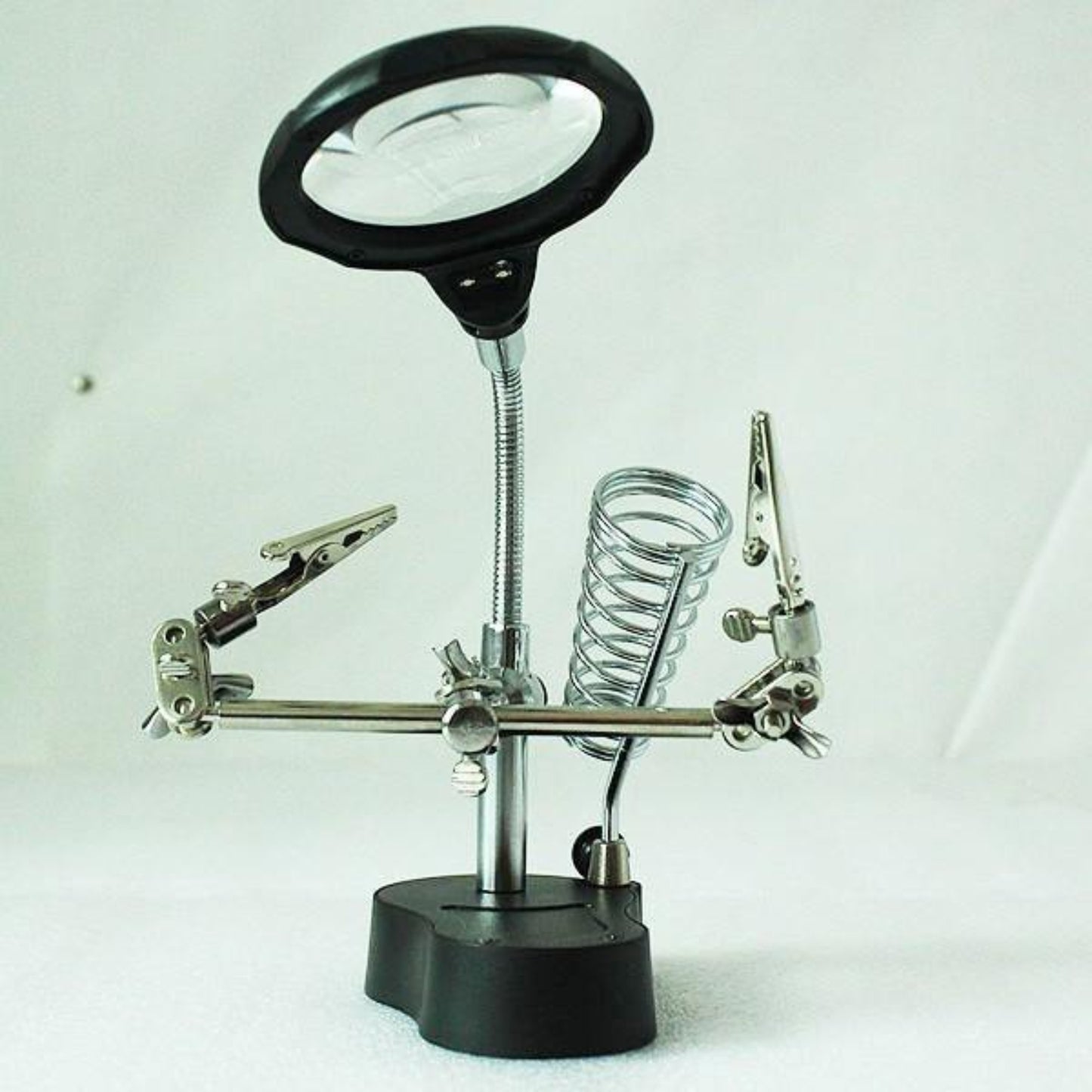 3.5X 12X magnifying glass tool with soldering iron stand for hands-free close work on jewelry and electronics.