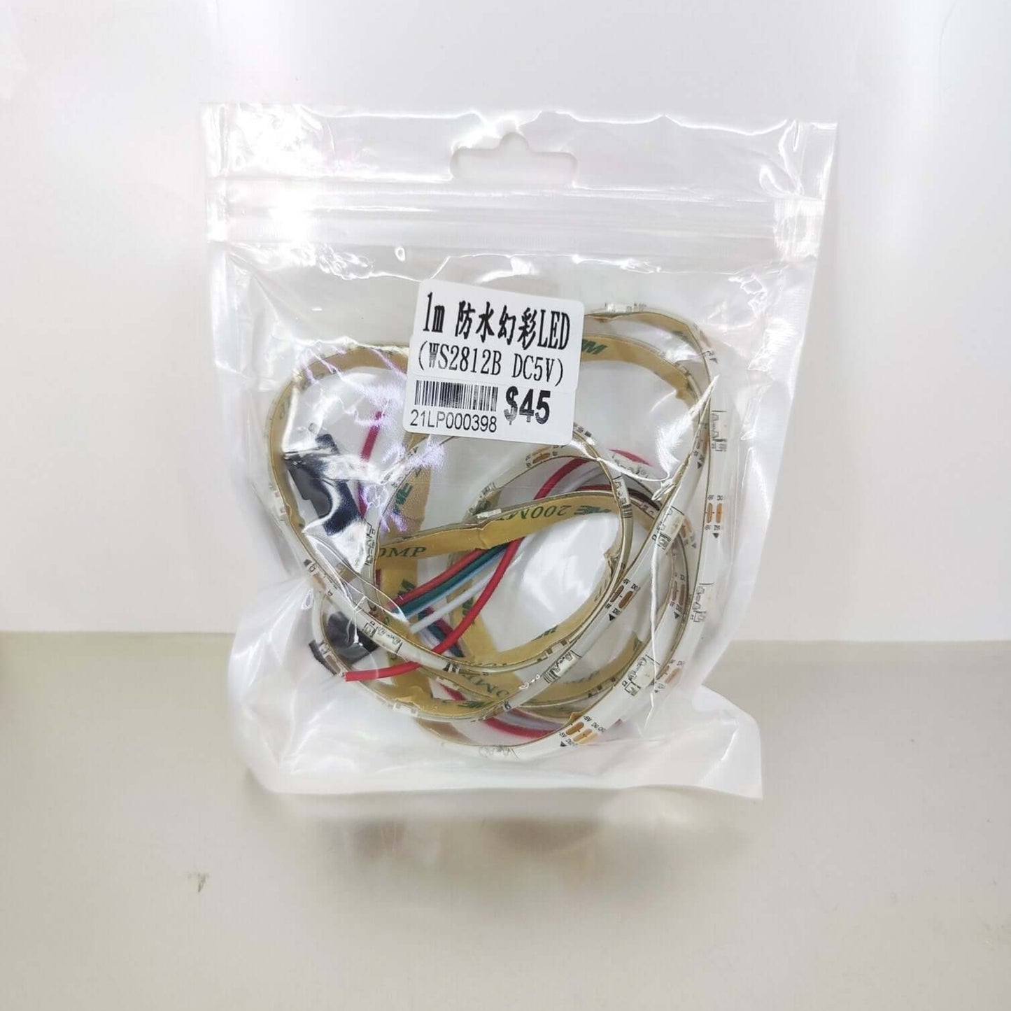 1m WS2812B Addressable LED Strip 5V DC. Waterproof smart pixel light in retail packaging.