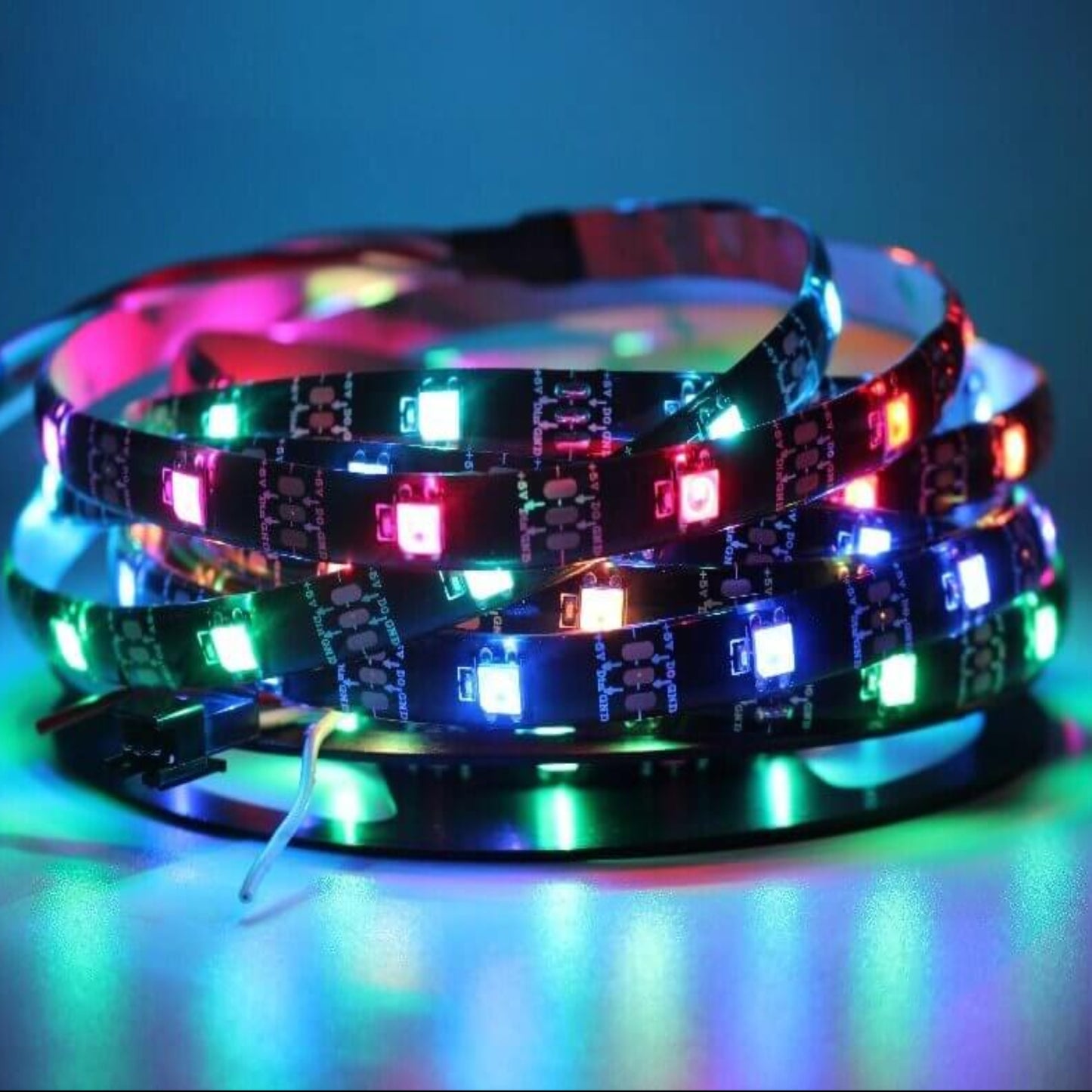 WS2812B programmable LED strip displaying running full-color RGB effects.